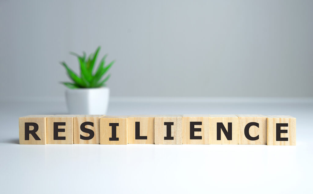 Resilience word concept on cubes on white background