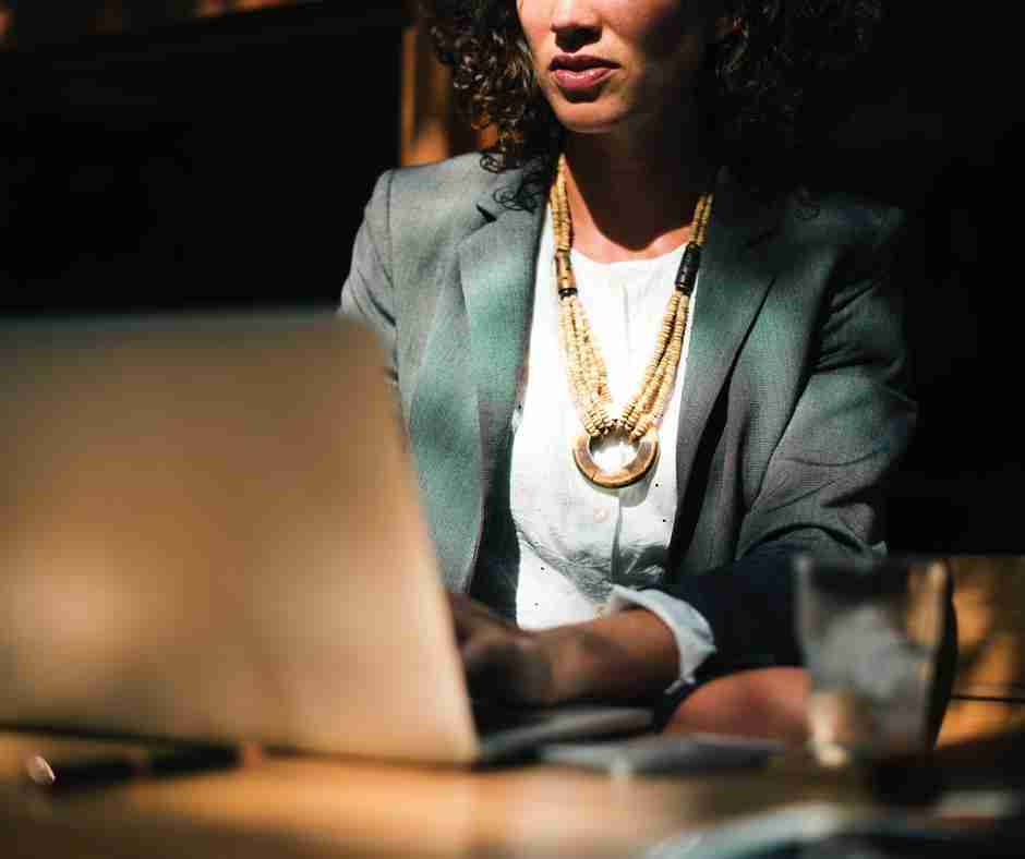 photo of entrepreneur business woman sitting at desk