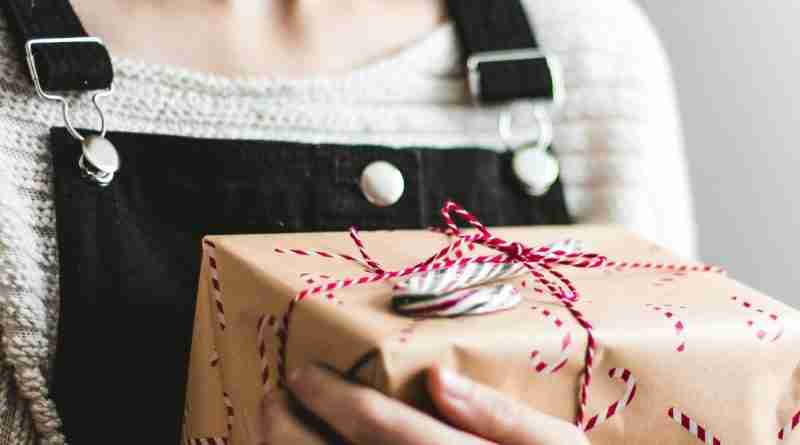 Photo of sad girl with holiday gift by Kira auf der Heide on Unsplash