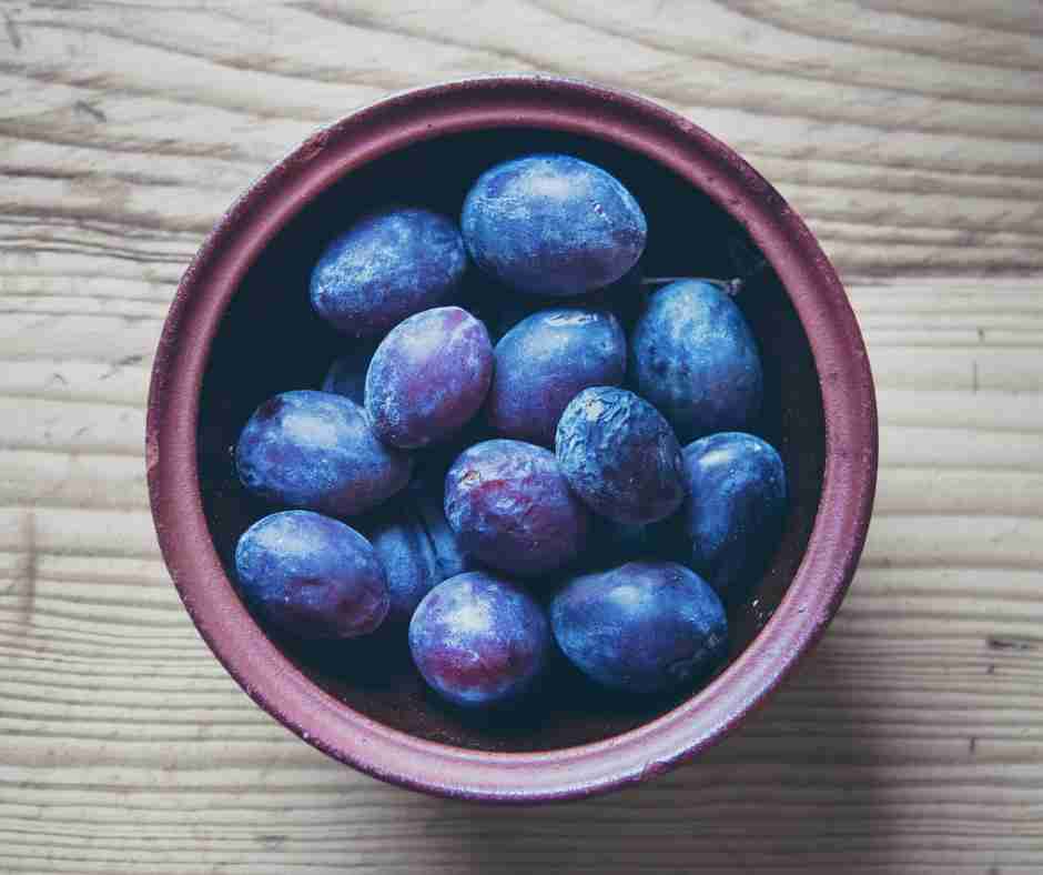 birds-eye view of a bowl of plums