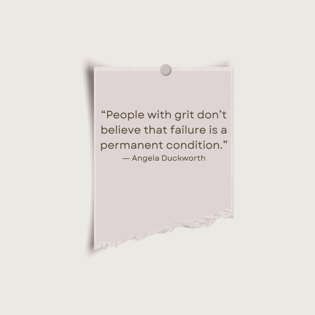 Pink piece of paper with a quote that says "People with grit don't believe that failure is a permanent condition. - Angela Duckworth"