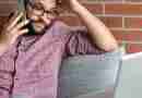 Photo of man on the phone in front of his computer looking frustrated. Image by Steve DiMatteo from Pixabay