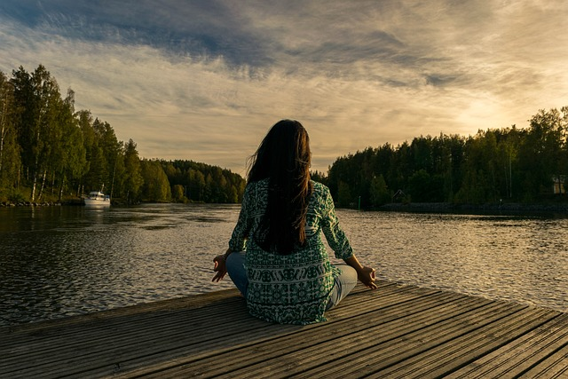 A woman doing yoga in nature, which were important themes in these mindfulness quotes.