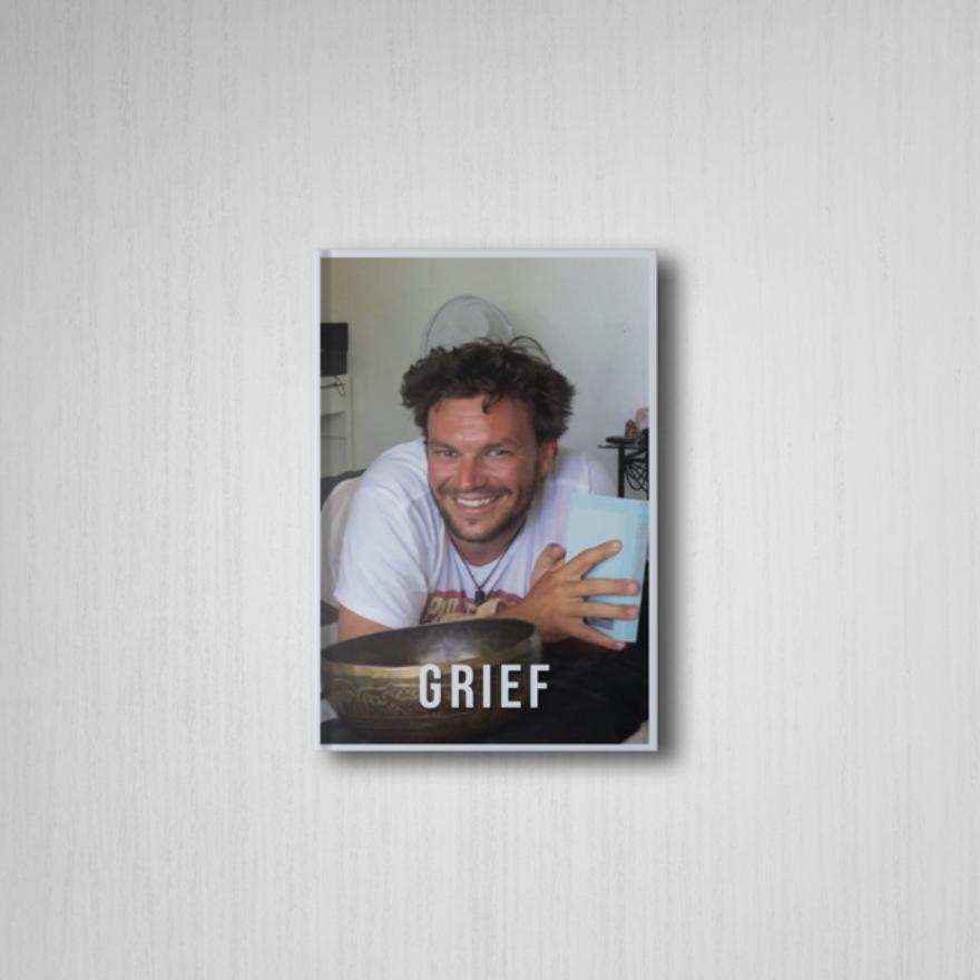 A photo of the book mock up with Muzz's face and the title, Grief.