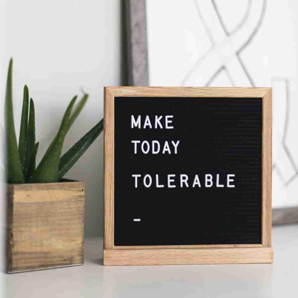 Photo of a letter board that says "make today tolerable"