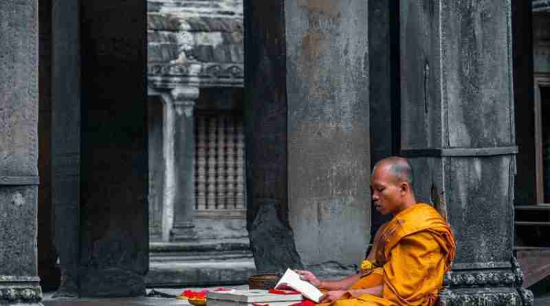 Image of buddhist monk practicing mantra meditation outside temple by theminjukim from Pixabay