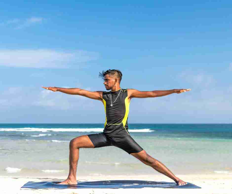 Untitled design (47) - Resilient Stories Man doing yoga on beach