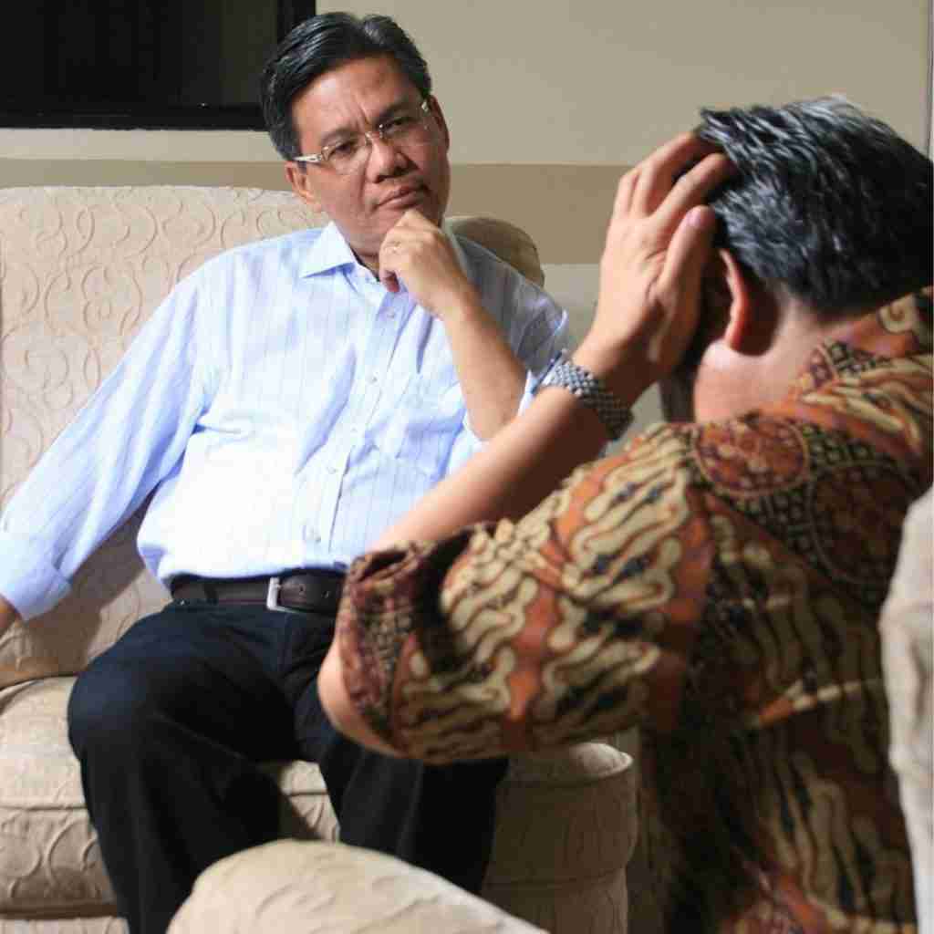 STOICISM (4) - Resilient Stories Photo of therapist in session with patient struggling with little t trauma stressors.