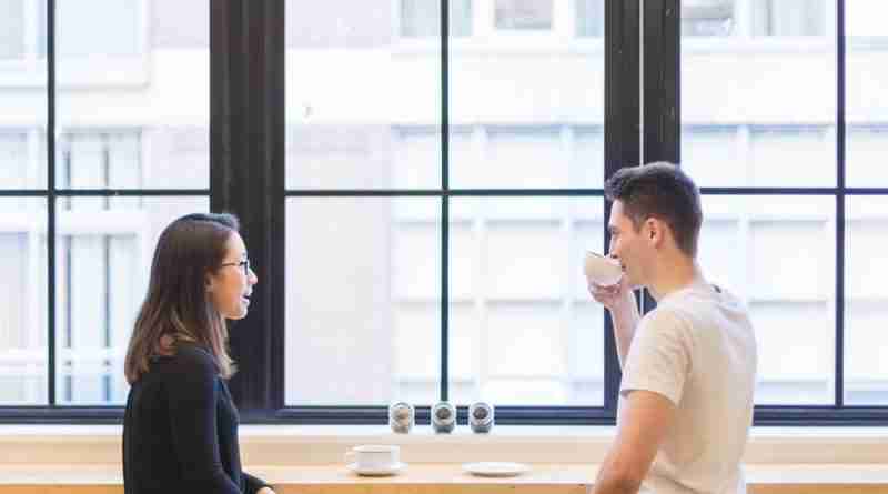 Asian man and woman sitting in from of large window enjoying a conversation over tea/coffee. Image by StockSnap from Pixabay