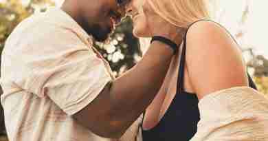 Photo of interracial couple embracing, happy in love. Photo by Letícia Pelissari on Unsplash