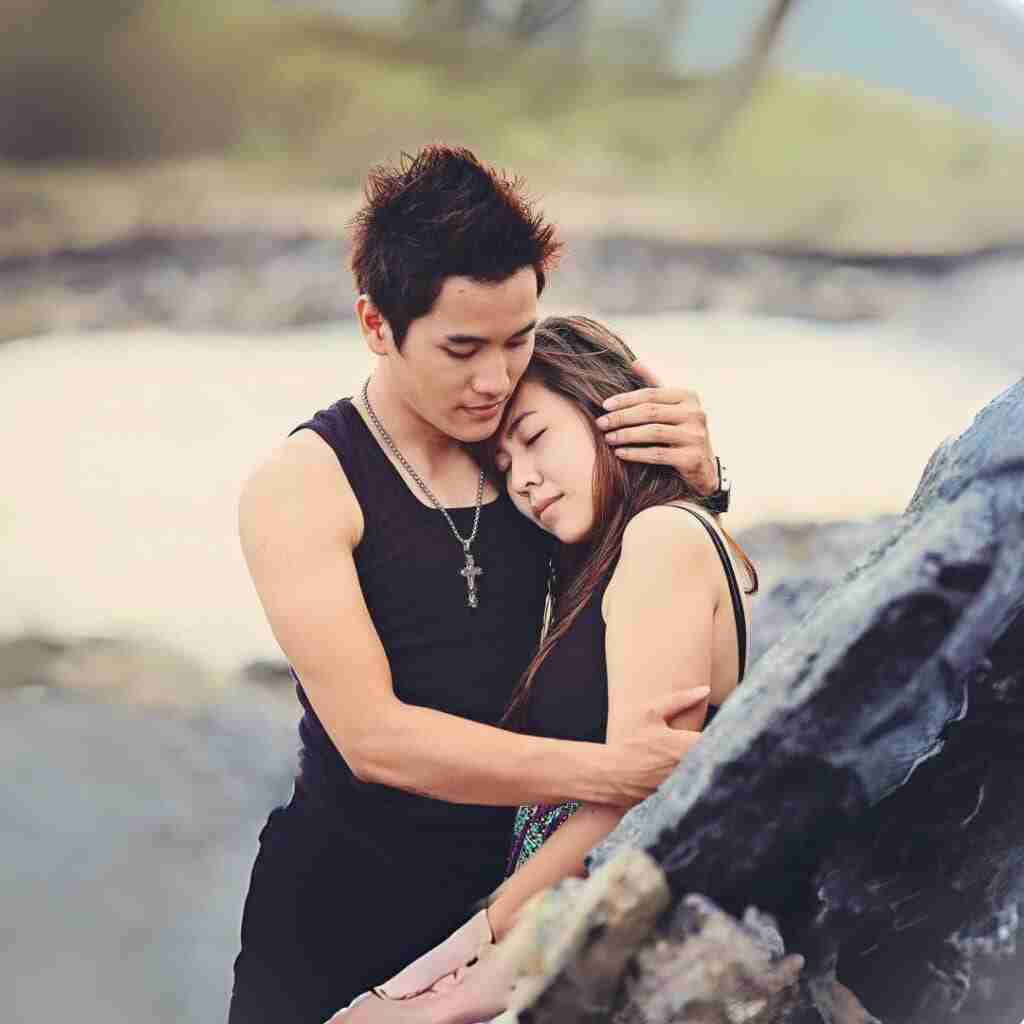 emosoul - Resilient Stories Image of young Asian couple in a warm embrace, depicting the depth of emotional soul ties.