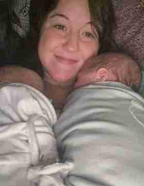 Kristin Oesterle holding her newborn twin sons.