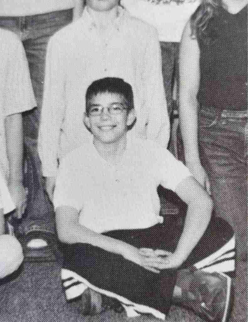 Jeremy in 6th grade, pictured with a boot on after one of his many surgeries due to being a tbi survivor.
