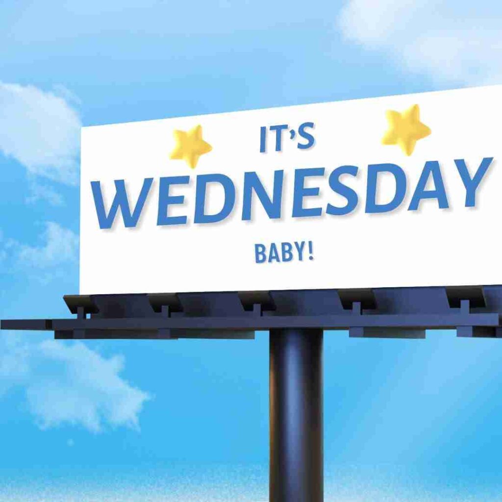 Billboard set against bright blue sky that reads "It's Wednesday Baby!"