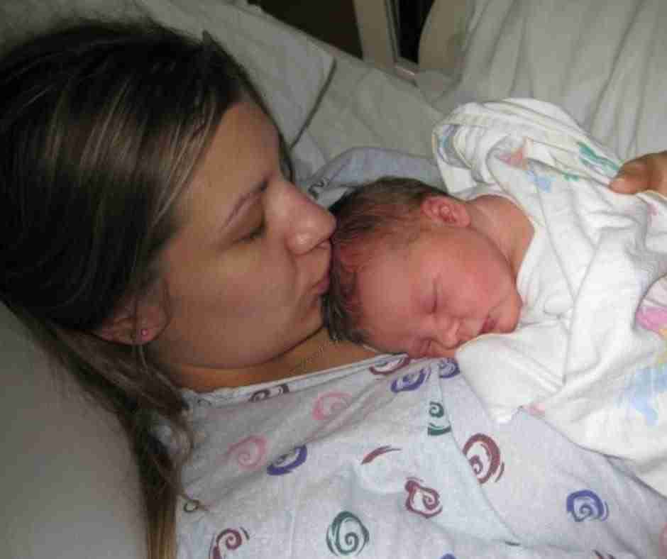 Photo of Krista and her newborn baby Jaelyn, whom she calls the divine intervention that began her healing journey.