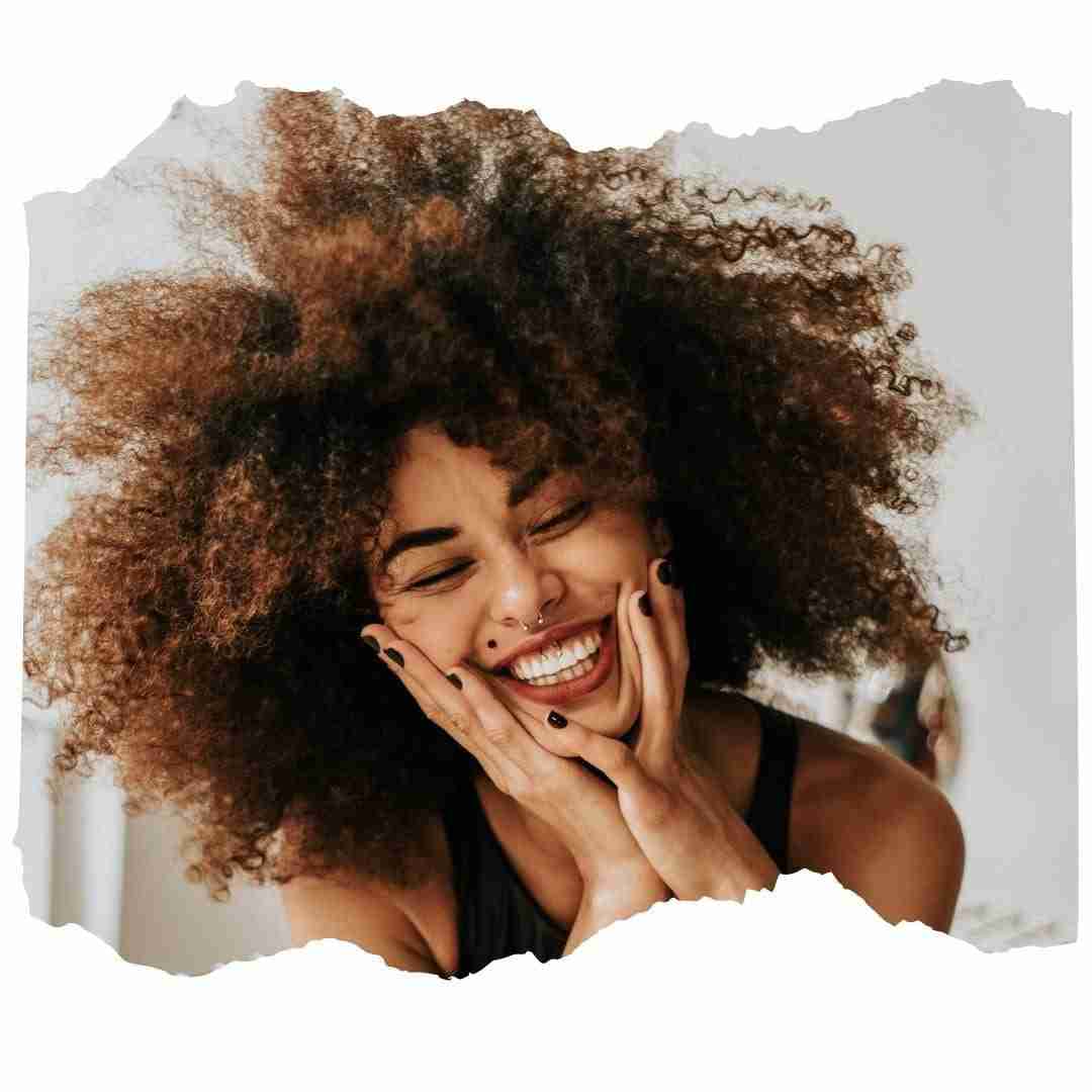 African American female who is happy and feeling emotional well-being.