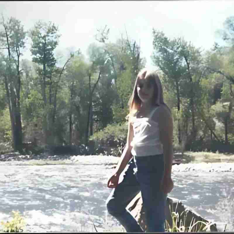 A photo of the author when she was a child playing in a Montana river.