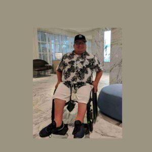 Mitch Bohn in his wheelchair in hotel room