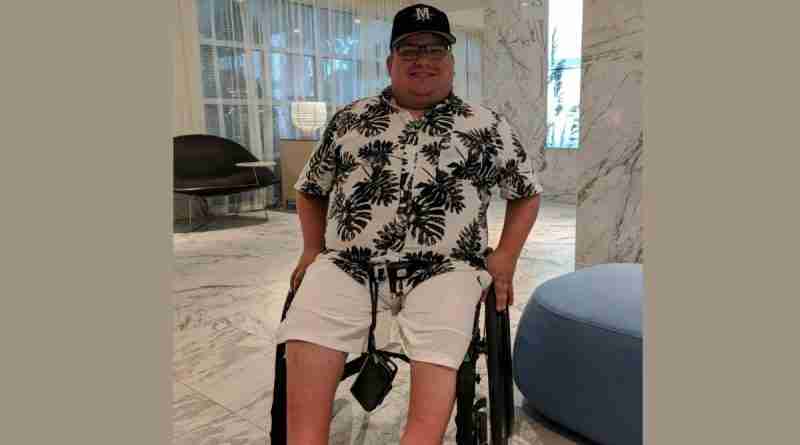 Mitch Bohn in his wheelchair in hotel room