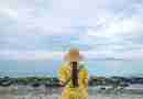Girl on beach in yellow dress and hat. Image by Thuan Vo from Pixabay