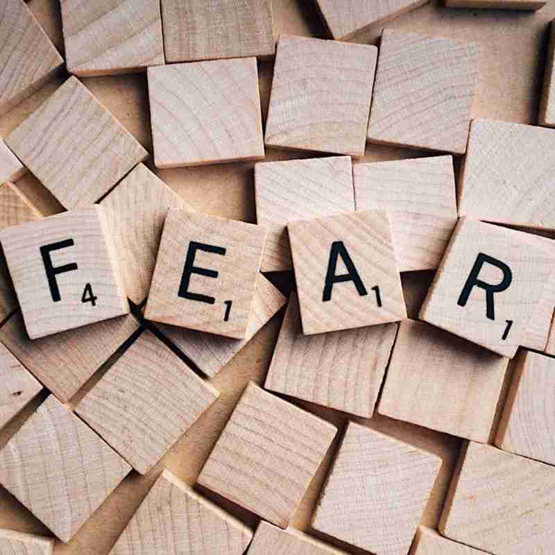 The emotion word "fear" is spelt on Scrabble tiles.