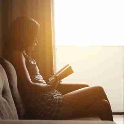 11 - Resilient Stories Photo of woman reading inspirational quotes in the sunlight. Image by Nino Souza Nino from Pixabay