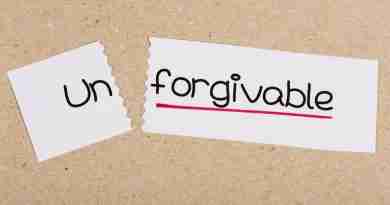 The word "unforgivable" is written on a slip of paper with the word un torn off. Choosing to forgive or not forgive someone is a personal choice.