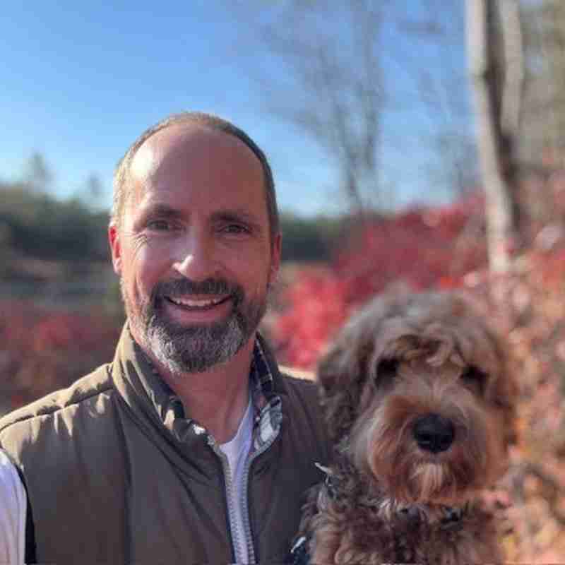 A photo of Jim and his dog.
