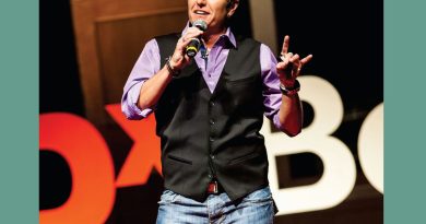 A photo of Ash Beckham on the TEDx Boulder stage.