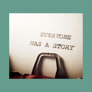 The words "Everyone has a story" appear on typeset font on a piece of paper still in the typewriter.