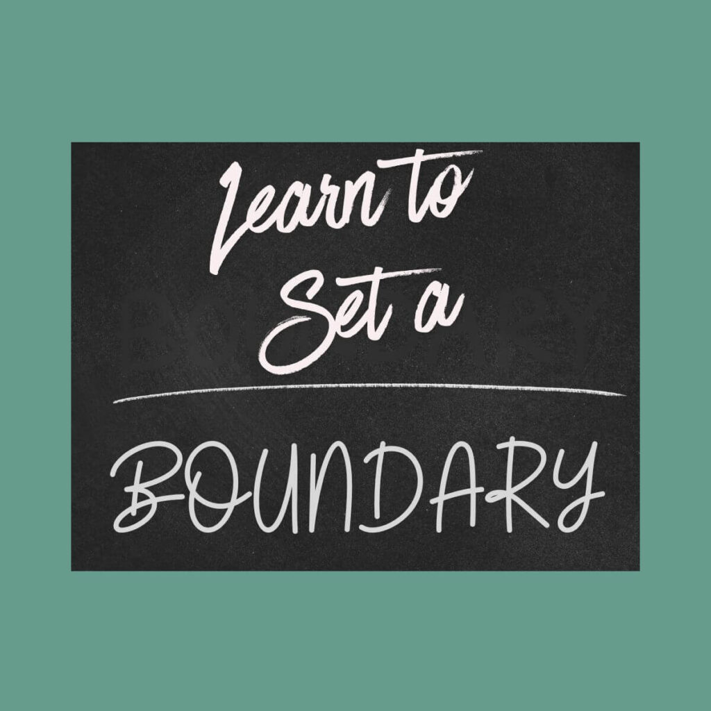 Learn to set a boundary is written on a chalkboard.