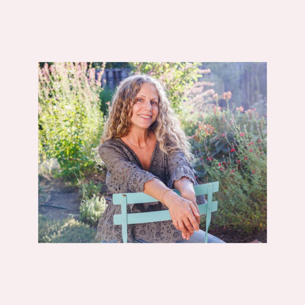 A photo of the author in her garden.