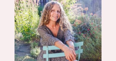 A photo of the author in her garden.