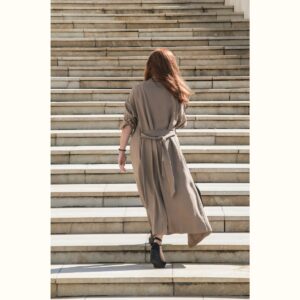 A photo of a woman walking away. It demonstrates Kristi walking away from the women she will never be.